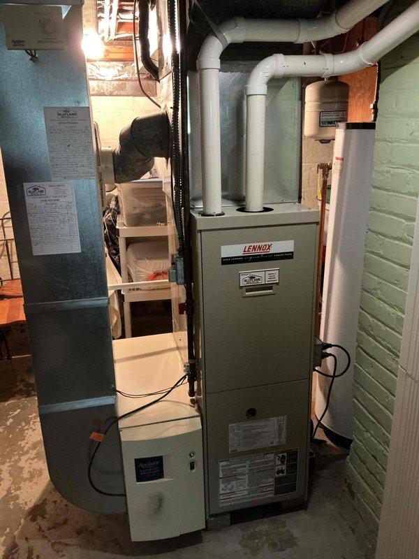 Completed preventive maintenance tune-up on 10-year-old Lennox HVAC system located in basement mechanical room. Performed comprehensive inspection of furnace unit and air handler, checked all electrical connections, cleaned components, verified proper operation of all safety controls, inspected PVC vent piping and condensate drainage system, and confirmed equipment is operating within manufacturer specifications. Customer renewed maintenance plan coverage, and all system components are functioning properly with no immediate service needs identified.