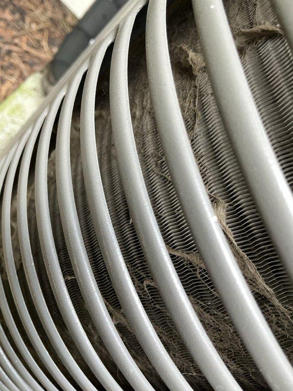 Performed routine maintenance on an 8-year-old air conditioning system. Inspected evaporator coil assembly and documented moderate dust and debris accumulation on heat exchanger fins and refrigerant lines. Completed standard tune-up procedures to ensure continued system efficiency and proper operation.