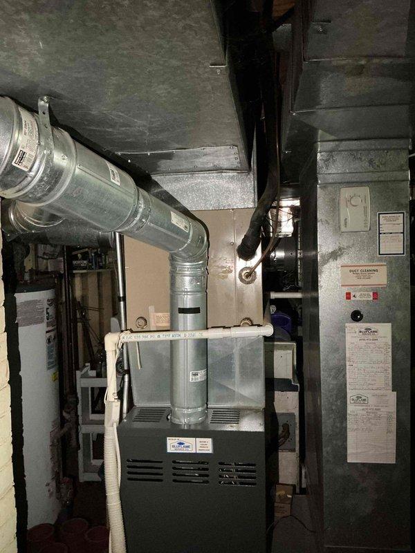 Completed comprehensive air conditioning tune-up on 38-year-old Trane XE 900 system. Performed standard maintenance protocol including inspection of outdoor condenser unit, indoor furnace components, ductwork connections, and electrical systems; noted significant age-related wear on equipment with accumulated debris on condenser coils and exterior surfaces requiring cleaning for optimal performance.