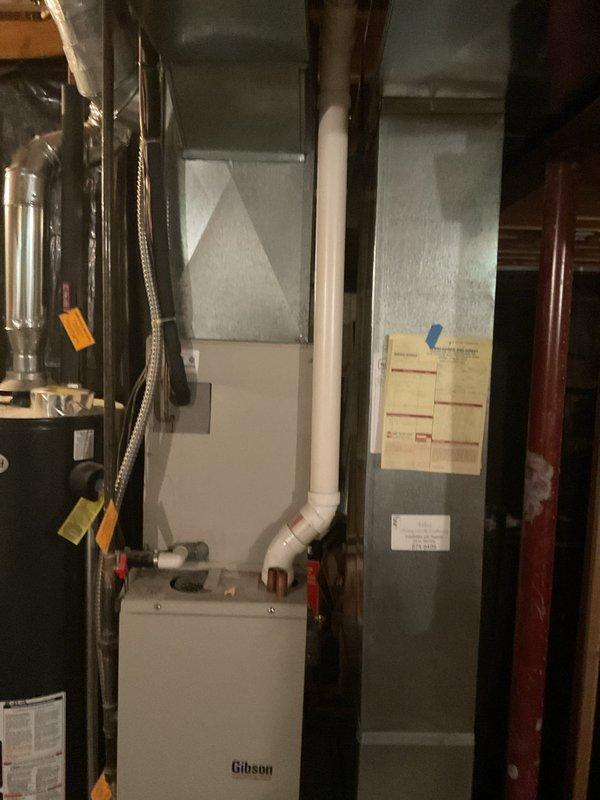 Conducted comprehensive on-site assessment of existing HVAC system in residential basement mechanical room for complete system replacement estimate. Evaluated current Gibson furnace unit, air handler configuration, and associated ductwork infrastructure. Documented equipment specifications, spatial constraints, and installation requirements through detailed photography of mechanical room layout, including PVC venting configuration, electrical connections, and existing duct system to provide accurate replacement system recommendations and installation planning.