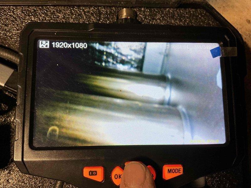 Completed cooling maintenance on 4-year-old air conditioning system. Performed comprehensive system inspection using borescope camera to examine internal ductwork and components. Identified need for 16x25x4 furnace filter replacement and documented HVAC system configuration including flexible ductwork and PVC condensate drain lines.