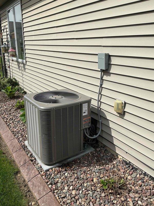 # HVAC Install - Complete System

Completed full residential HVAC system installation including outdoor condensing unit and indoor control components. Installed new AC condenser on gravel pad with proper electrical disconnects, conduit routing, and code-compliant wiring connections. Mounted and wired control board with integrated diagnostics and safety features. Performed system startup procedures and verified proper operation of all components. Addressed airflow imbalance concerns between bedrooms by evaluating ductwork distribution and system controls to optimize heating performance throughout the home.