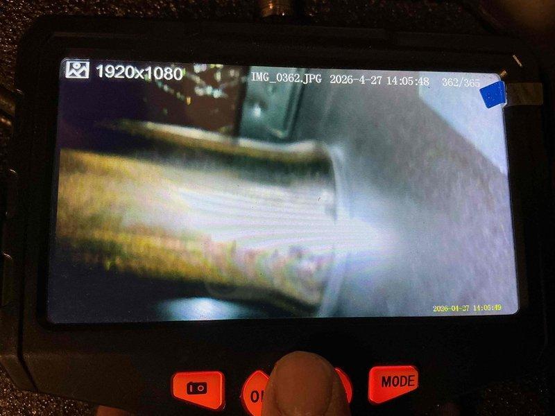 Performed cooling system maintenance and inspection on HVAC unit. Conducted internal diagnostic inspection using borescope camera to examine interior components, ductwork, and evaporator coil condition. Documented system condition with visual inspection images showing interior mechanical components and surfaces for maintenance records.