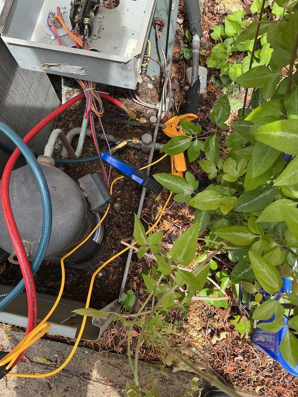 Performed scheduled cooling system maintenance on residential HVAC unit. Connected manifold gauge set to measure refrigerant pressures and used digital instruments to verify supply air temperature at indoor registers. System operating within normal parameters upon completion of service visit.