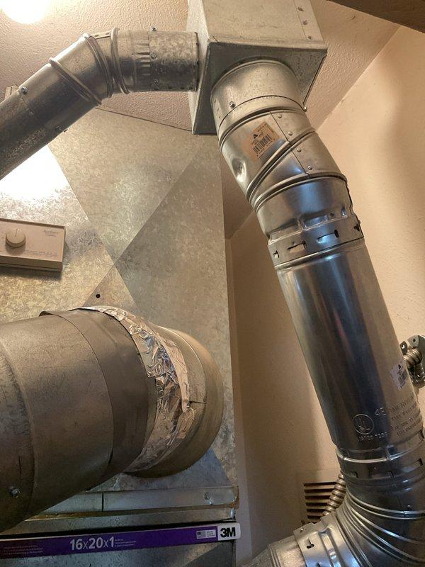 Completed comprehensive assessment of existing HVAC system for full replacement estimate. Evaluated current Amana gas furnace installation, ductwork configuration throughout attic space, and associated ventilation components. Documented existing equipment conditions including furnace cabinet, cylindrical supply ductwork, flexible duct connections, and air filtration system integration. Assessed utility room layout with current furnace and water heater positioning to determine optimal replacement configuration. Photographed ductwork transitions, access points, and mechanical space constraints to provide accurate system replacement specifications and equipment sizing recommendations.