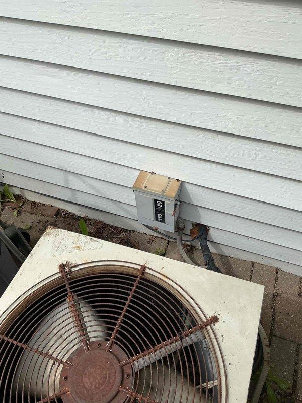 Completed comprehensive preventive maintenance tune-up on 30-year-old outdoor air conditioning condensing unit located in backyard. Performed standard inspection protocol including electrical connections, refrigerant levels, condenser coil cleaning, fan motor operation verification, and system performance testing. Unit showed significant age-related wear with rust present on fan guard assembly, though system remained operational within acceptable parameters for continued service.