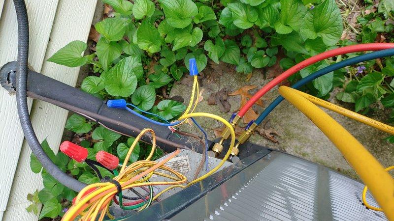 Responded to service call for 9-year-old central air conditioning system with non-operational outdoor fan. Upon arrival, performed diagnostic testing using refrigerant manifold gauges to assess system pressures and temperatures. Identified electrical fault in outdoor unit fan motor circuit. Repaired wiring connections at condensing unit, secured all electrical connections with appropriate wire nuts, and verified proper voltage supply to fan motor. System tested and restored to full operational status with outdoor fan running properly and unit cooling effectively.