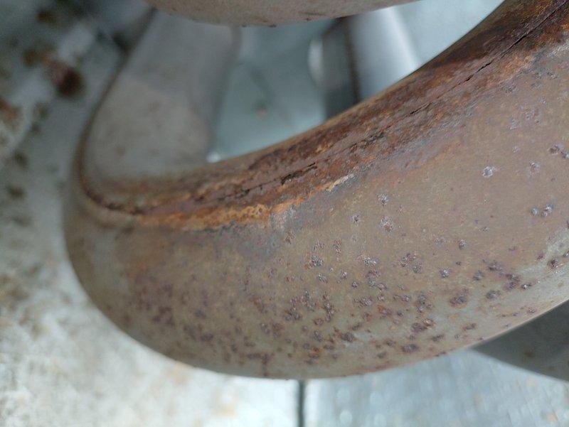 Responded to no-heat call for furnace system at church facility. Upon inspection, discovered severely corroded heat exchanger with extensive rust damage and surface deterioration along seams and welded joints. The furnace, over ten years old, exhibited compromised structural integrity of the heat exchanger due to prolonged moisture exposure and age-related oxidation. Documented the corrosion damage with photographs showing rust penetration and metal deterioration. Advised that the heat exchanger failure poses safety concerns and requires immediate attention, as continued operation could result in carbon monoxide hazards. Recommended full furnace replacement given the age of the unit and extent of heat exchanger damage.