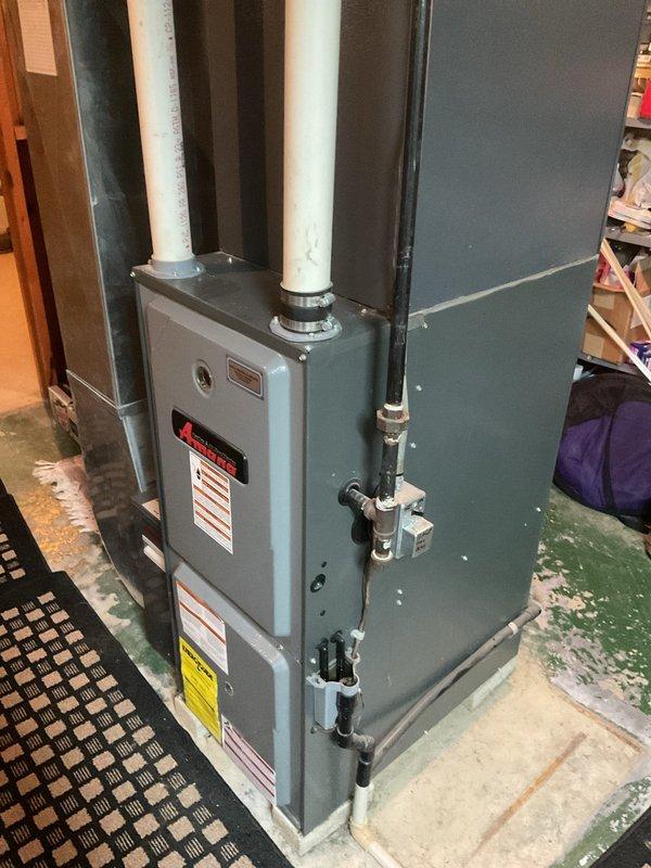 Provided comprehensive estimate for complete HVAC system replacement including 3-ton air conditioning unit, outdoor condenser, and two evaporator coils. Assessment covered existing indoor air handler and furnace configuration in basement utility area, as well as exterior condenser unit positioned on concrete pad against building exterior, with detailed evaluation of refrigerant line routing, electrical connections, and ductwork integration requirements for seamless system upgrade.