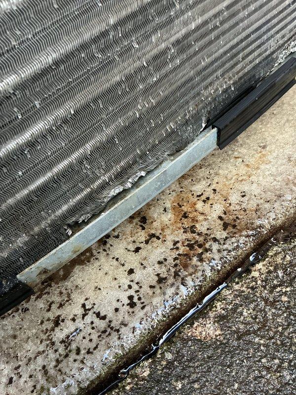 Responded to no cooling complaint on residential air conditioning system. Upon arrival, performed visual inspection of outdoor condenser unit which appeared to be in operational condition with clean fan grille and intact housing. Unit was documented with photos showing heat exchanger coils and outdoor installation on concrete pad. System requires further diagnostic testing to determine root cause of warm air discharge, as initial visual inspection did not reveal obvious mechanical failures or refrigerant leakage at condenser unit.