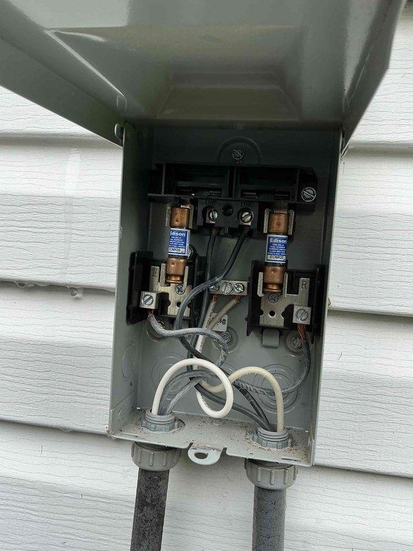 Completed comprehensive air conditioning tune-up including inspection of electrical disconnect box, verification of cartridge fuses and wiring connections, and capacitor testing. Customer was advised that furnace filter requires replacement at this time.