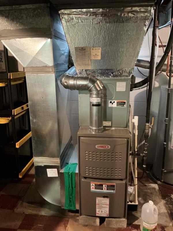 Completed maintenance visit on 21-year-old residential air conditioning system. Performed comprehensive cooling season preventive maintenance inspection on Lennox HVAC system located in basement mechanical room. Inspected furnace unit, evaporator coil assembly, and associated components including refrigerant lines, condensate drainage system, and electrical connections. Verified proper operation of condensate pump mounted adjacent to furnace. Checked all gas line connections, PVC condensate piping, and flexible ductwork connections for integrity and proper installation. System operational at time of departure.