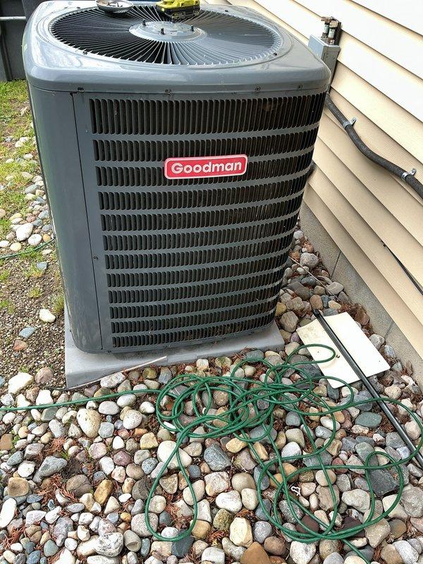 Completed scheduled maintenance on a 4-year-old Goodman air conditioning system. Performed visual inspection of outdoor condenser unit, noting accumulated debris in heat exchanger fins that was addressed during service, and verified all components were operational per manufacturer specifications.