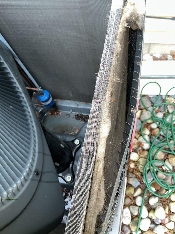 Completed scheduled maintenance on a 4-year-old Goodman air conditioning system. Performed visual inspection of outdoor condenser unit, noting accumulated debris in heat exchanger fins that was addressed during service, and verified all components were operational per manufacturer specifications.