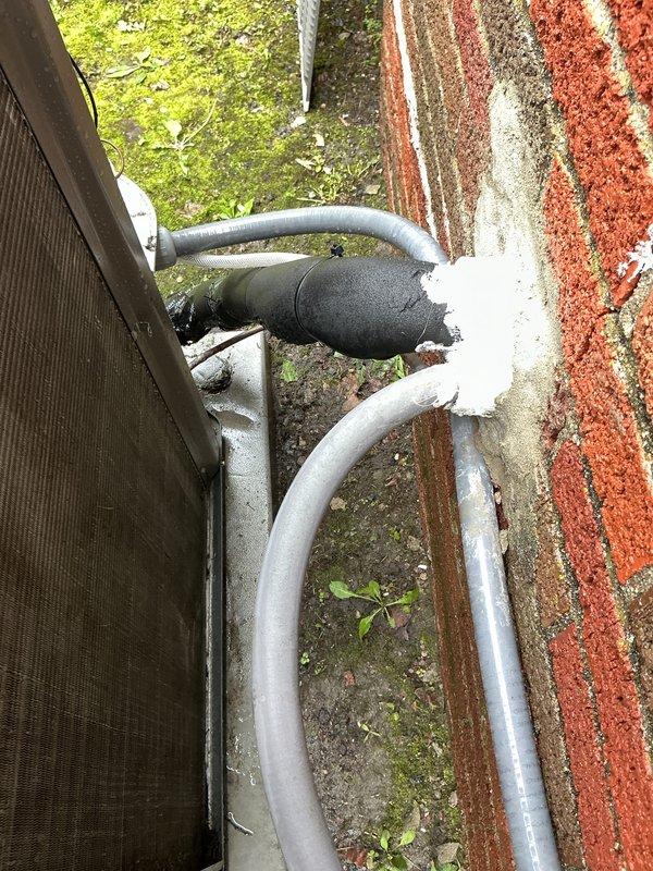 Completed first annual air conditioning maintenance visit as part of recurring service plan included with system installation. Performed comprehensive cooling system inspection including examination of exterior refrigerant linesets, service valves, and filter drier components. All refrigerant lines showed proper insulation integrity with normal outdoor weathering, and interior equipment components including electrical connections and controls were verified to be in proper working condition.