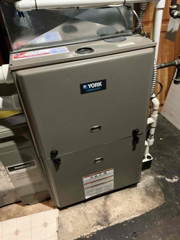 Completed comprehensive preventive maintenance tune-up on 20-year-old York HVAC system located in basement mechanical room. Performed standard cooling season inspection protocol including refrigerant level verification, condenser coil cleaning at exterior unit, electrical connection testing, and filter assessment to ensure optimal system performance for the upcoming cooling season.
