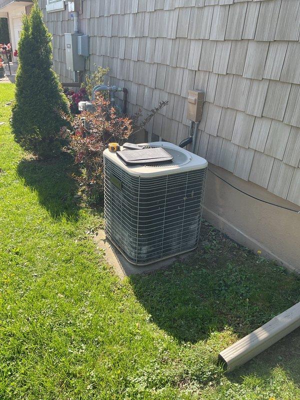 Completed comprehensive HVAC system replacement estimate for residential property with aging equipment. Evaluated existing Lennox furnace from 2007 and outdoor air conditioning condenser unit, both showing signs of extended service life. Documented current system configuration including PVC venting, electrical connections, and installation conditions. Assessed ductwork connections, clearances, and accessibility for replacement equipment. Photographed existing furnace installation in basement utility area and outdoor condenser unit positioning on concrete pad adjacent to home exterior. Provided homeowner with detailed replacement options for complete heating and cooling system upgrade to improve efficiency and reliability.