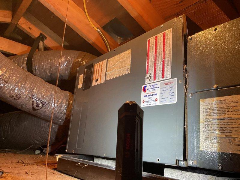 Completed full heat pump system installation including indoor air handler unit mounted in attic space and outdoor condensing unit positioned on concrete pad adjacent to structure. Repaired damaged flexible ductwork and secured all connections to air handler with proper insulation wrapping. Installed electrical disconnect at outdoor unit with conduit run to brick exterior, verified all electrical connections meet code requirements, and confirmed system operational parameters upon startup.