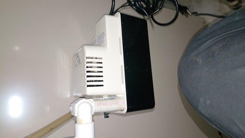Responded to service call for furnace leaking water. Upon inspection, identified failed condensate pump allowing water to overflow and discharge onto concrete floor, causing visible water damage and staining. Replaced malfunctioning condensate pump with new unit, tested drainage system for proper operation, and verified furnace resumed normal heating cycle without further water leakage.