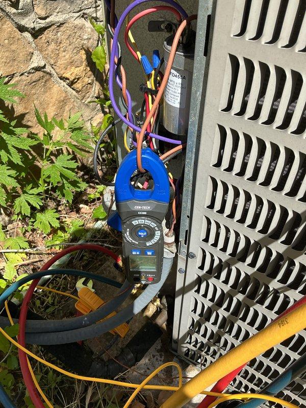 Completed MVP cooling maintenance on 13-year-old air conditioning system. Performed comprehensive system diagnostics including electrical measurements using digital multimeter to verify proper voltage and amperage at the outdoor unit. Connected refrigerant manifold gauges to assess system pressures and confirm adequate refrigerant charge. Inspected indoor ductwork, including insulated flex duct runs and PVC condensate drain lines for proper installation and operation. All components tested within normal operating parameters and system confirmed operational.