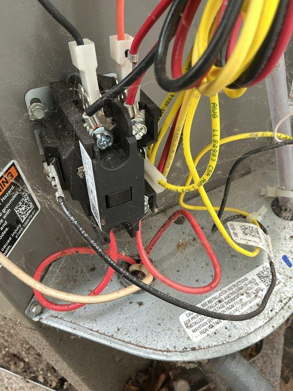 Completed scheduled maintenance on 2-year-old air conditioning system. Inspected and verified proper operation of electrical components including contactor, dual fuse assembly with TR25R time delay fuses, and control wiring connections. All components found in good working condition with normal wear patterns; system operating within specifications.