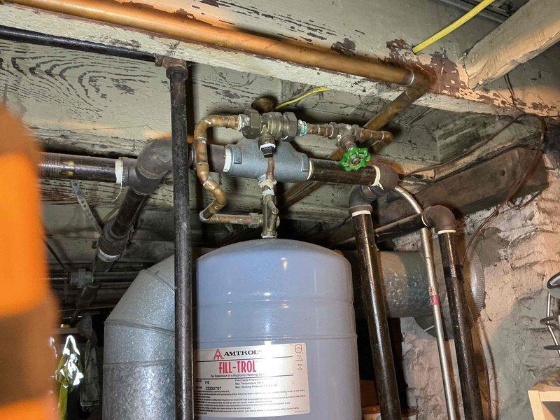 Completed comprehensive tune-up and safety inspection on gas-fired hydronic boiler system. Performed combustion analysis, cleaned and inspected burner assembly, checked all safety controls, tested expansion tank pre-charge, verified proper operation of circulator pumps and zone valves, and inspected all visible piping connections for leaks. Customer was contacted with findings and system performance details prior to processing payment, and all work was approved before completion.