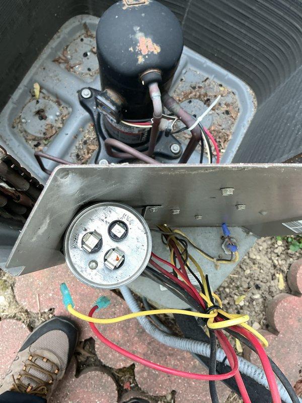 Completed routine cooling maintenance on a 19-year-old air conditioning system. Performed comprehensive inspection of outdoor condensing unit, including examination of electrical components, dual run capacitor, contactor, and refrigerant line connections. All wiring bundles, terminals, and electrical connections were inspected and found to be secure and functioning properly despite the unit's age and normal environmental wear.