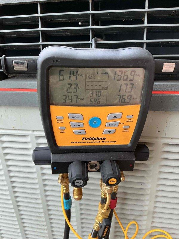 Reconnected air conditioning system that had been previously disconnected by another contractor for excavation work. Performed system startup, evacuated refrigerant lines, and recharged unit to manufacturer specifications using manifold gauges to verify proper pressures. System tested and confirmed operational with normal cooling performance restored.