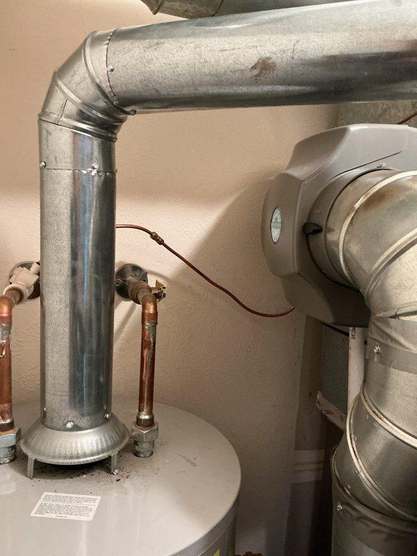 Completed full HVAC system installation consisting of AHRI-certified match 215585040: Lennox 14.7 SEER 2-ton single-stage condenser paired with 80% AFUE 70,000 BTU downflow gas furnace. Installed downflow cased evaporator coil, 12-gallon whole-home humidifier, and new copper line set with metal armoring for refrigerant lines. Prepared outdoor equipment pad with stone leveling base to ensure proper condenser placement and drainage. Installed new electrical disconnect and whip for outdoor unit, connected all ductwork transitions to existing infrastructure, and mounted L-40 programmable thermostat. Verified system levelness using precision tools, tested all electrical connections, and confirmed proper airflow through supply and return ductwork. System commissioned successfully with all components operating within manufacturer specifications.