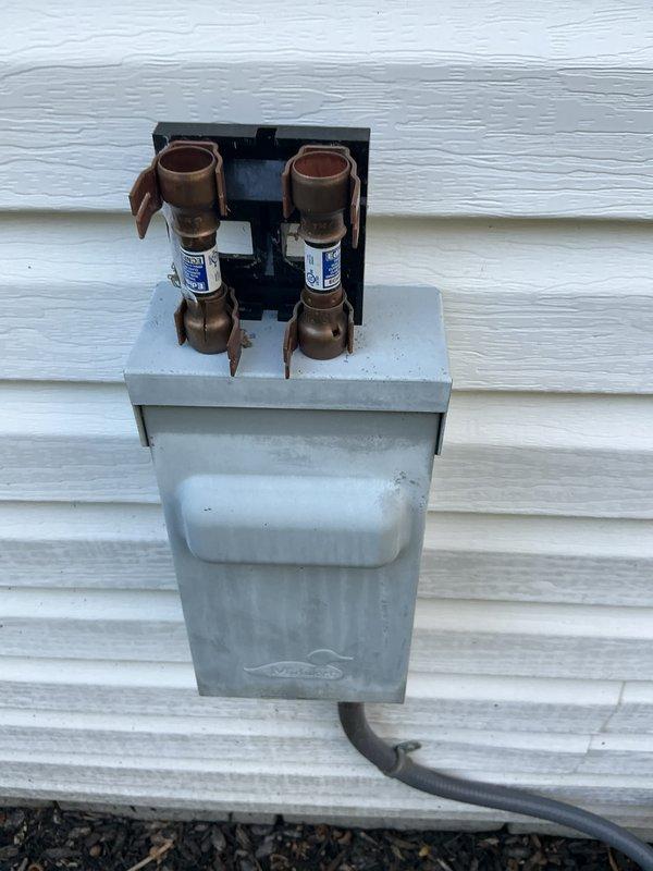 Completed comprehensive air conditioning tune-up and system inspection on residential unit. Performed standard maintenance procedures including electrical connection inspection, where brownish discoloration and potential heat damage were observed on terminal block connections, indicating possible loose connection or oxidation requiring monitoring. All accessible components were evaluated and system operational parameters verified at time of service.