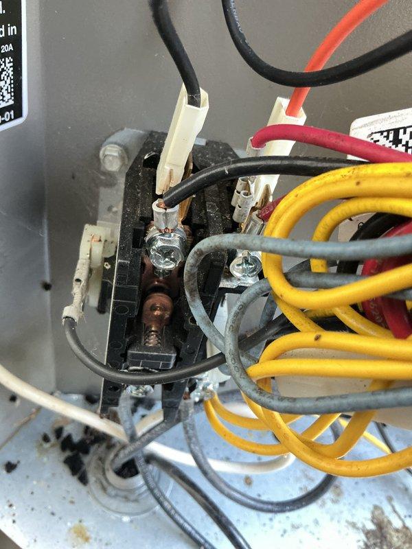 Completed comprehensive air conditioning tune-up and system inspection on residential unit. Performed standard maintenance procedures including electrical connection inspection, where brownish discoloration and potential heat damage were observed on terminal block connections, indicating possible loose connection or oxidation requiring monitoring. All accessible components were evaluated and system operational parameters verified at time of service.