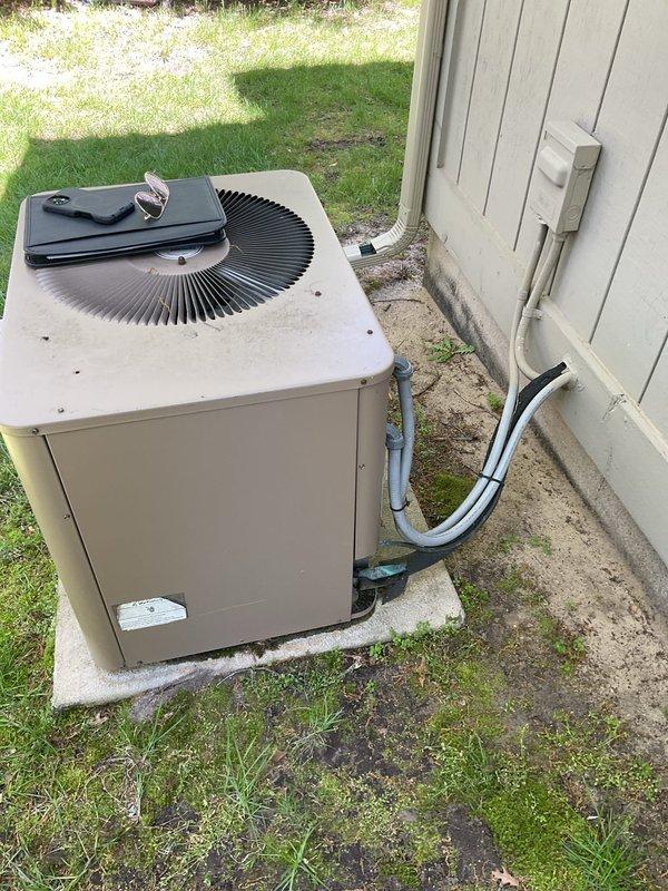 Responded to service call for central air conditioning system experiencing icing on outdoor unit and inadequate cooling despite new air filter. Performed diagnostic evaluation of complete HVAC system including outdoor condenser unit and indoor air handler located in basement utility area. Assessed refrigerant lines, electrical connections, and overall system condition to determine whether repair or replacement would be most cost-effective solution. Documented equipment condition with photographs and provided customer with comprehensive estimate for system replacement options based on findings.