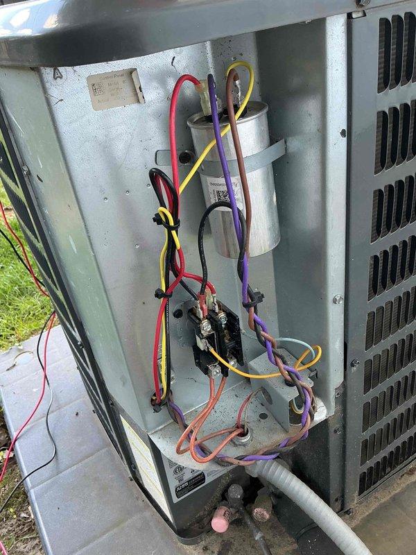 # HVAC Maintenance Service Completed

Performed routine maintenance on a 6-year-old Goodman air conditioning unit. Accessed electrical compartment to inspect capacitor, contactor, and wiring connections; verified all components were functioning properly. Checked condensate drainage line routing and confirmed proper system operation.
