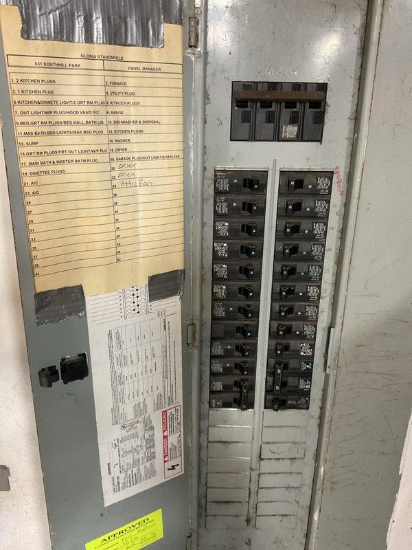 Conducted on-site evaluation for complete air conditioning system replacement at residential property. Assessed existing Rheem furnace, air handler, and associated HVAC equipment in utility room to determine compatibility and requirements for new AC installation. Documented current electrical panel configuration and circuit availability to ensure adequate power supply for replacement system, noting existing furnace circuit and available breaker capacity for new condensing unit connection.