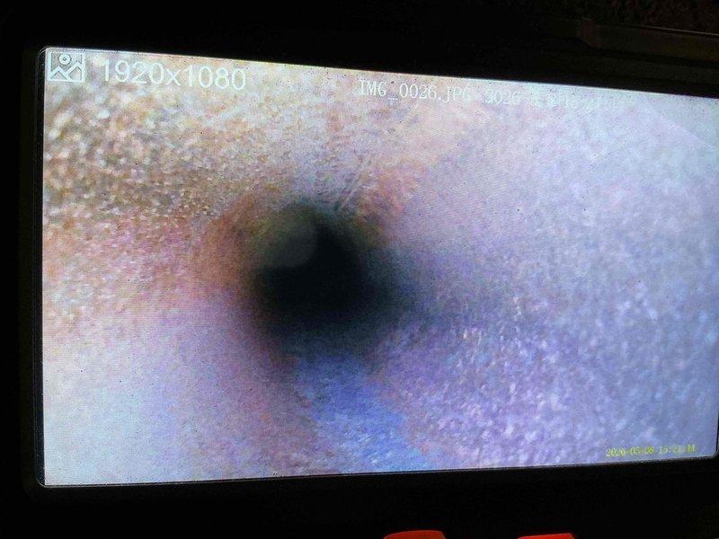 Performed pre-sale inspection of furnace system at buyer's request. Conducted visual examination of unit components, heat exchanger integrity, and burner assembly. Utilized inspection camera to assess internal heat exchanger condition and flue pipe surfaces for signs of corrosion, rust, or deterioration. Documented findings with photographic evidence of piping condition and internal components showing age-related wear and oxidation on metal surfaces.