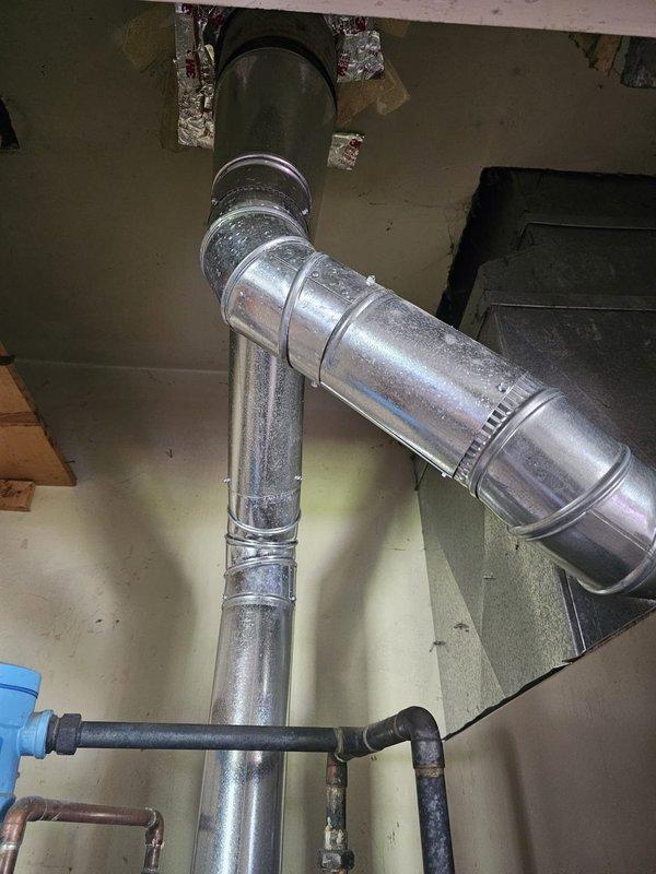 Completed full HVAC system installation including a 13 SEER 2-ton single stage condensing unit with matching downflow cased coil. Installed new 3/4" x 30' refrigerant line set with proper insulation, new condensing unit pad, disconnect box and whip for electrical connection. Fabricated and installed required ductwork metal transitions to integrate coil with existing system. Mounted new Honeywell thermostat, evacuated and charged system to manufacturer specifications, and verified proper operation of all components.