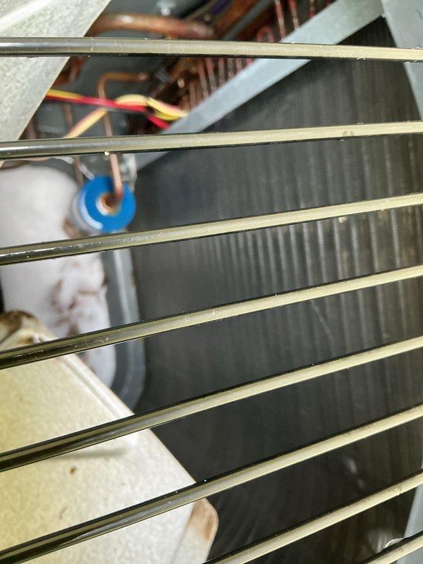 Completed routine air conditioning maintenance visit as part of recurring service agreement. Performed system inspection, checked refrigerant temperatures using digital thermometer showing 64°F reading at evaporator coil, and verified proper operation of condenser unit heat exchanger fins, copper refrigerant lines, capacitor, and electrical connections. All components found in good working condition with system operating within normal parameters.