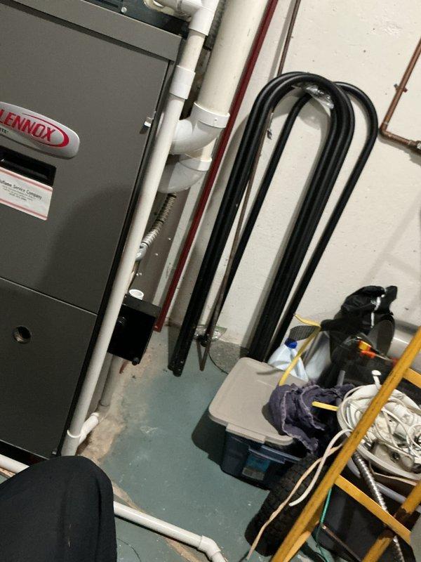 Completed maintenance visit plan on 10-year-old air conditioning system serving a 9-to-1 window configuration. Inspected Lennox air handler unit in basement mechanical room, verified proper operation of condensate drainage system with white PVC piping. Tested and evaluated electrical components including capacitor, confirmed proper readings on diagnostic gauges. All equipment operating within normal parameters at time of service.