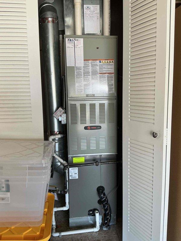 Completed annual cooling maintenance on residential Trane HVAC system per home plan agreement. Performed comprehensive inspection of outdoor condensing unit, verifying proper operation of compressor, condenser fan motor, and electrical components including capacitor and contactor. All electrical connections were secure with no signs of overheating or deterioration. Checked refrigerant pressures and confirmed system is operating within manufacturer specifications. Inspected indoor air handler and furnace unit, verified proper airflow and filter condition. Documented system condition with photos showing clean electrical compartment and properly functioning components. Unit is one year old and operating efficiently with no issues identified requiring immediate attention.