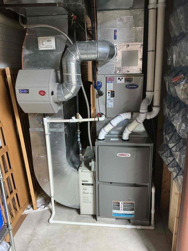 Completed annual air conditioning tune-up and preventative maintenance on approximately 20-year-old Carrier HVAC system with outdoor condensing unit. Performed comprehensive inspection of indoor air handler, evaporator coil, ductwork, humidifier, and Air Bear filtration system. Verified proper operation of all components, checked refrigerant levels, cleaned coils as needed, and ensured system is operating efficiently for the cooling season.