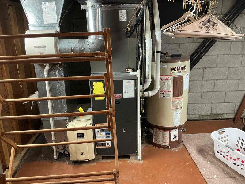 Completed comprehensive air conditioning tune-up on 18-year-old system with 2:30 PM appointment following morning call-ahead confirmation. Performed standard maintenance protocol including filter inspection, refrigerant level check, electrical connection testing, condensate drain evaluation, and thermostat calibration to ensure optimal system performance for the cooling season.