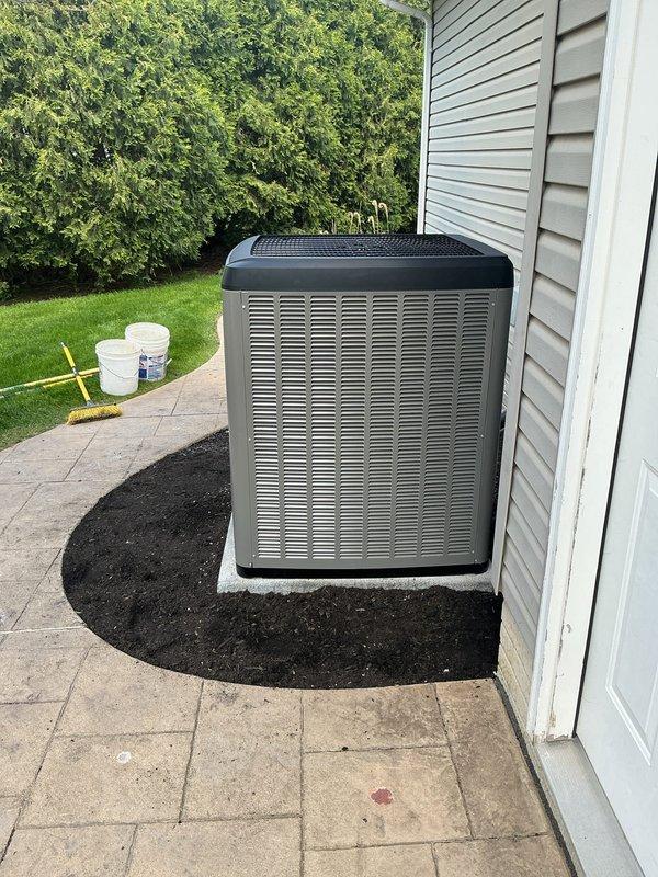 Completed full AC system replacement at residential property. Excavated existing concrete pad and re-leveled base using gravel for proper drainage and stability. Successfully recovered refrigerant from old unit by pumping it down into the system before removal. Installed new condenser unit on prepared pad with fresh mulch landscaping, connected refrigerant lines with insulation, and verified all electrical connections to disconnect box. System tested and operational upon completion.