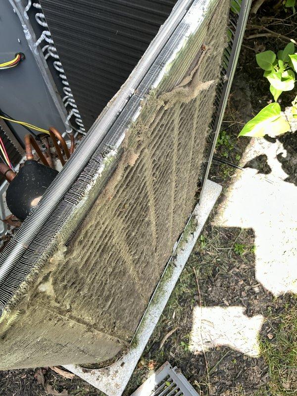 Performed annual maintenance on a 2-year-old air conditioning system. Cleaned heavily soiled outdoor condenser coil that had significant algae, dirt, and biological buildup obstructing airflow through the aluminum fins. Inspected control board, electrical connections, and wiring for proper operation and secure terminations.