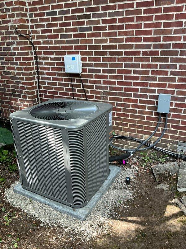 Completed installation of 14 SEER 4-ton air conditioning system with matching upflow cased coil in basement mechanical room. Removed existing humidifier and installed new 7/8" x 30' lineset, concrete equipment pad, electrical disconnect, and whip connection. Pulled new 8-conductor wire to existing thermostat location and configured system for proper operation. All components tested and verified functional upon completion.