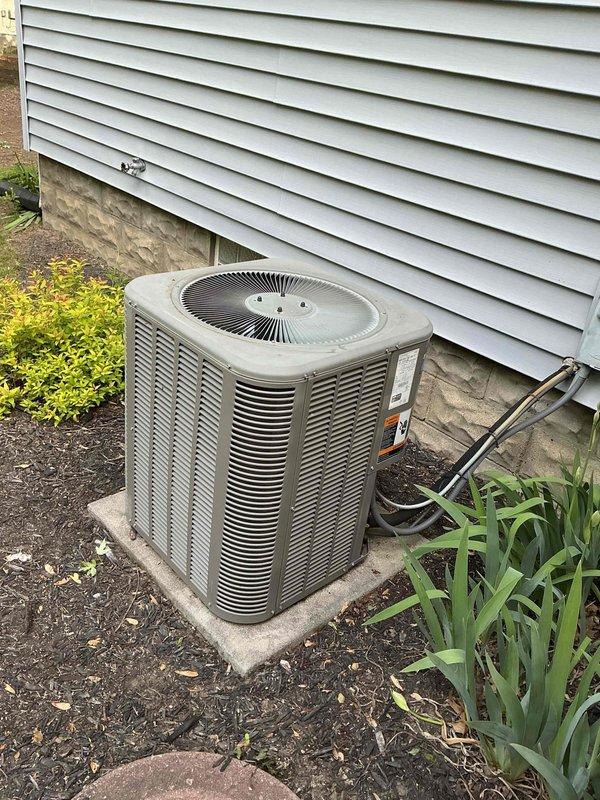 Completed routine maintenance on 15-year-old residential cooling system, including inspection of electrical components, capacitor testing, and verification of proper operation. Unit exterior and internal wiring connections were examined and found to be in functional condition, with all safety checks performed according to MVP Cooling Visit protocol.