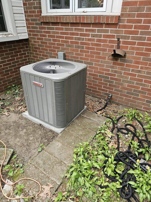 Completed installation of new HVAC system including horizontal slab coil in crawl space and single-stage condenser unit on exterior concrete pad. Installed new copper line set connecting indoor and outdoor components, mounted new disconnect box and whip for electrical service, and upgraded to programmable thermostat for improved temperature control. All components properly secured, insulated, and tested for optimal system performance.