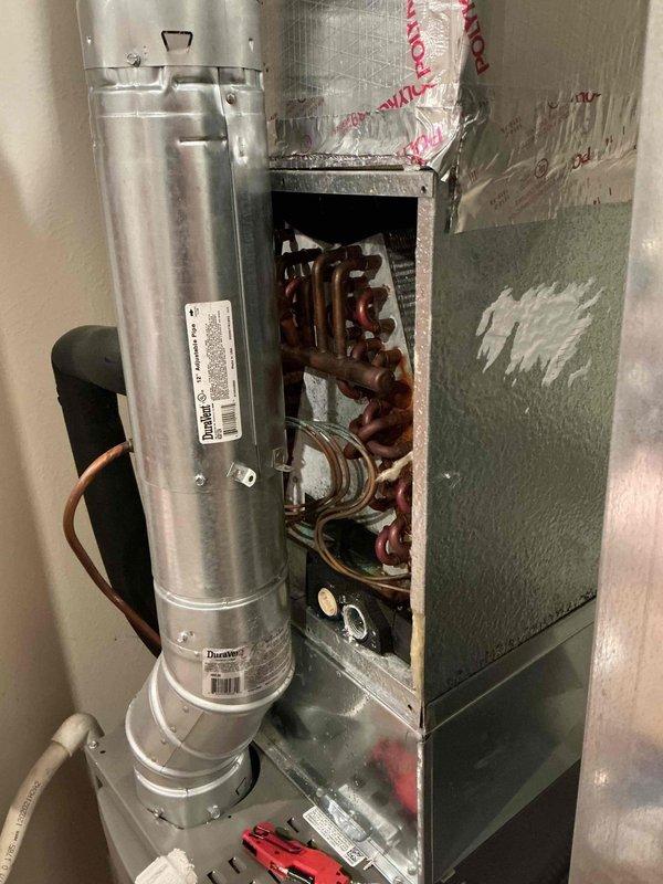 Responded to service call for water leak from furnace area occurring after first seasonal AC operation. Inspected 2-year-old Lennox HVAC system and identified clogged condensate drain line as source of water accumulation. Cleared blockage from condensate line, verified proper drainage flow, and tested AC system operation to confirm resolution. Noted exterior condenser unit fins heavily loaded with debris and recommended cleaning for optimal performance. System restored to normal operation with no further leakage observed.