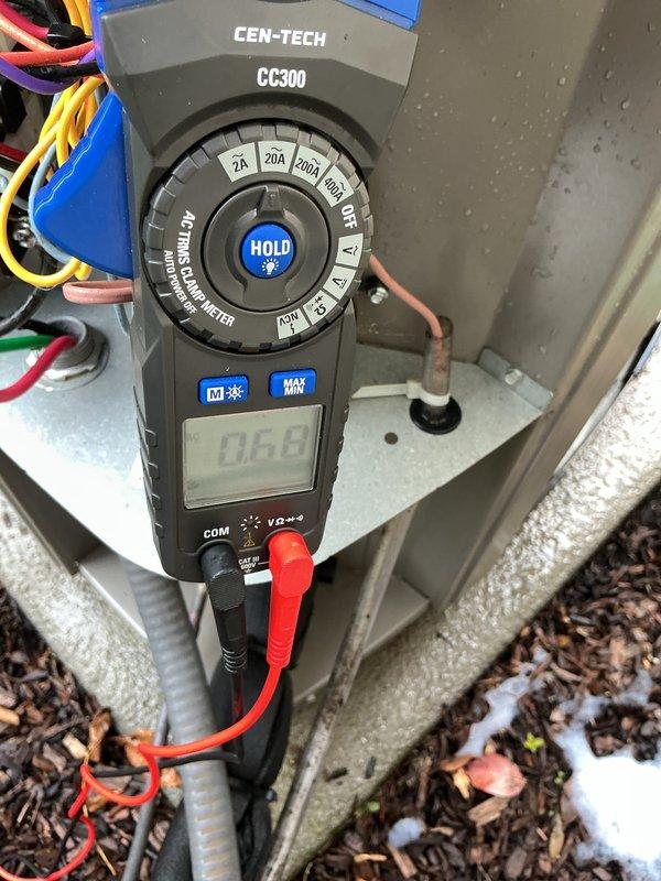 Completed comprehensive preventive maintenance tune-up on five-year-old residential air conditioning system. Performed standard inspection protocol including electrical measurements, visual assessment of exterior components, and documentation of equipment condition. Identified damaged electrical conduit at exterior disconnect box with torn protective covering exposing internal wiring, which will require repair or replacement to maintain proper weatherproofing and code compliance. Recorded amperage readings showing 0.668A during testing. All findings documented with photographs for customer follow-up scheduled for Monday.