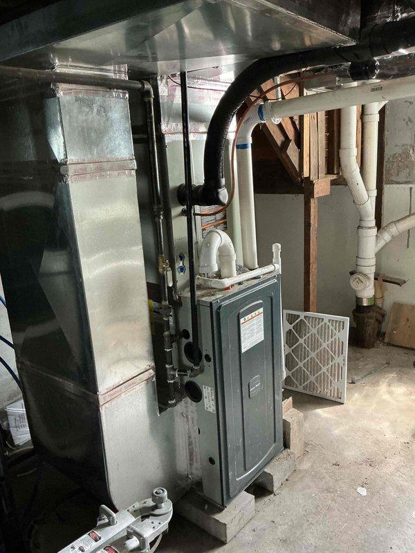 # HVAC Service Report

Responded to no cooling complaint on American Standard Silver Series air conditioning system approximately 3-5 years old. Upon arrival, performed comprehensive system diagnostic including visual inspection of both indoor furnace/air handler unit and outdoor condensing unit. Outdoor unit showed significant dirt and debris accumulation on condenser coils and interior components, with vegetation matter visible through ventilation grilles. Indoor air handler and ductwork connections inspected in basement mechanical room, with air filter condition evaluated. Completed standard diagnostic procedures to identify cause of cooling failure and provided customer with findings and repair recommendations.