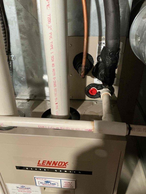 Responded to recall for air conditioning unit experiencing icing issues and failure to operate. Upon inspection, found Lennox system with refrigerant circuit problems causing complete loss of cooling to the home. Checked refrigerant pressures and system operation, identified abnormal operating conditions leading to evaporator coil freeze-up. Documented equipment condition including indoor air handler, furnace assembly, and associated components. System requires further diagnostic work to determine root cause of refrigerant-related failure and restore proper cooling function.